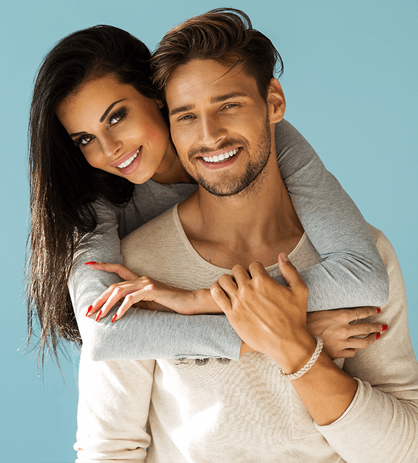 dark haired man and woman posing and smiling