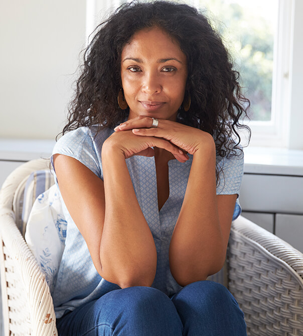 woman with curly hair sitting