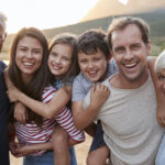 Multigenerational family with a mom and dad with their two kids and grandparents